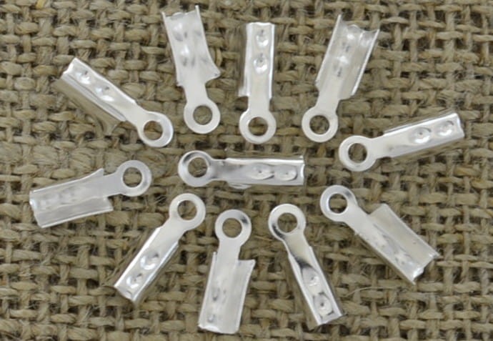 [571125] Końcówka sznurka srebrna 12*4mm 50szt
