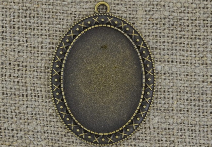 101185 Ozdobna baza medalionu w kolorze brązu na kaboszon 40*30mm