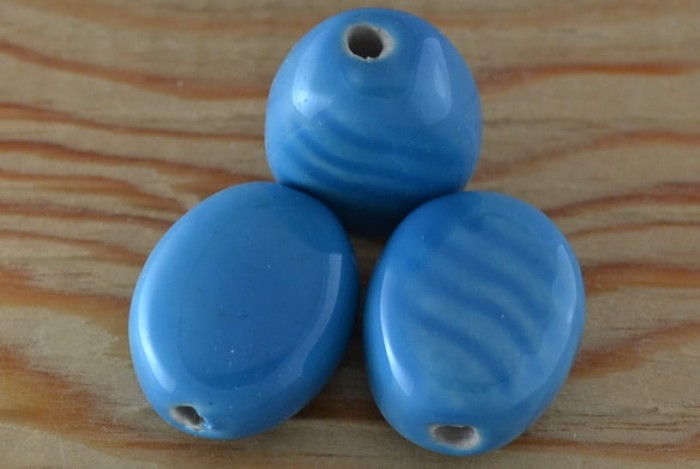 {760540} Koralik porcelanowy owalny 25*21mm błękitny