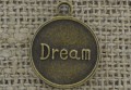 [107303] Zawieszka mała moneta "Dream" w kolorze brązu