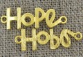 21257 Element ozdobny łącznik napis HoPe w kolorze złotym