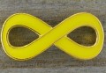Element ozdobny łącznik znak nieskończoności emaliowany żółty