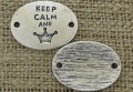 {312169} Element ozdobny łącznik "KEEP CALM AND" w kolorze srebrnym