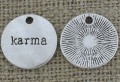 Zawieszka mała moneta "karma" kolor srebrny