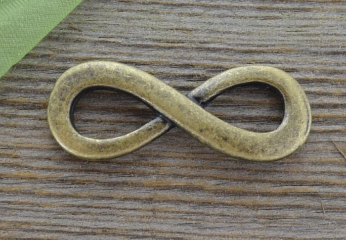 11260 Element ozdobny łącznik znak nieskończoności w kolorze brązu