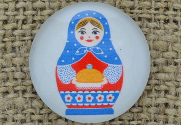 046162 Kaboszon szklany z obrazkiem matrioszka niebieska 20mm