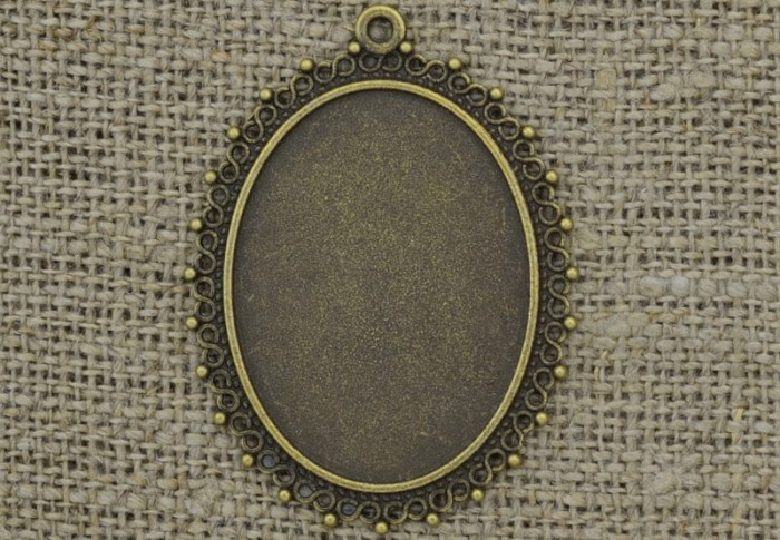 101196 Ozdobna baza medalionu w kolorze brązu na kaboszon 40*30mm