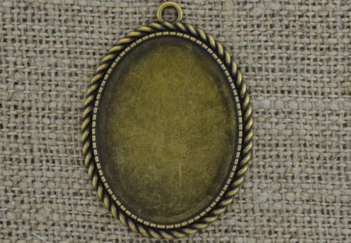 101183 Ozdobna baza medalionu w kolorze brązu na kaboszon 40*30mm