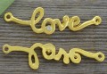 21215 Element ozdobny napis love z cyrkonią w kolorze złota