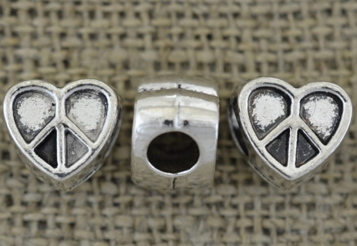 312159 Koralik modułowy serce z pacyfką w kolorze srebrnym