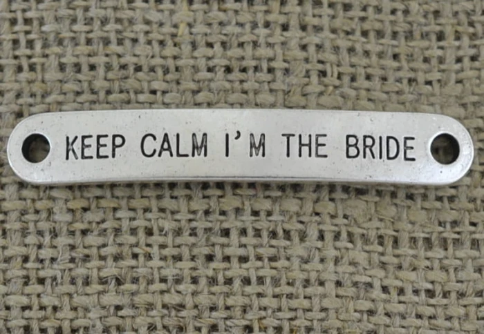[312180] Element ozdobny łącznik "KEEP CALM I ' M THE BRIDE" w kolorze srebrnym