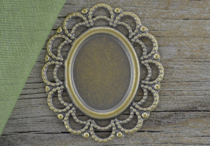 101136 Ozdobna baza medalionu w kolorze brązu na kaboszon 12*15mm 2szt