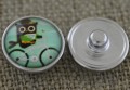 31842 Nap z kaboszonem z obrazkiem sowa na rowerze 18mm