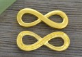 21214 Element ozdobny znak nieskończoności w kolorze złota