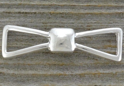 312123 Element ozdobny łącznik kokardka 38*11mm