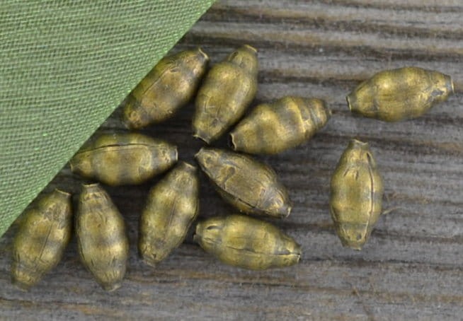 11255 Element ozdobny koralik podłużny 7*3mm w kolorze brązu 35szt