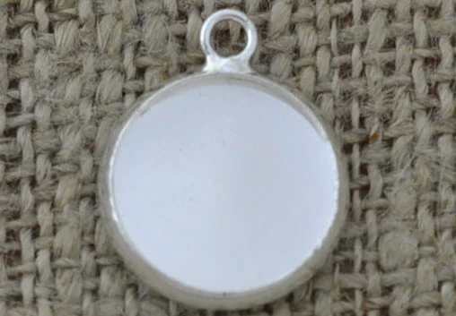 Baza medalionu w kolorze srebra kaboszon 12mm 2szt