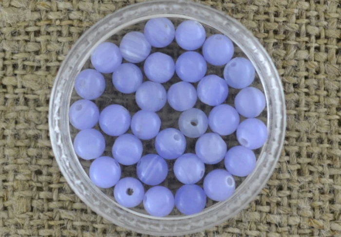 601245 Turkus syntetyczny kula 4mm w kolorze bzu 7szt