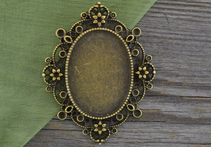 101100 Ozdobna baza medalionu w kolorze brązu na kaboszon 30*22mm