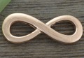 -1206 Element ozdobny znak nieskończoności w kolorze różowego złota