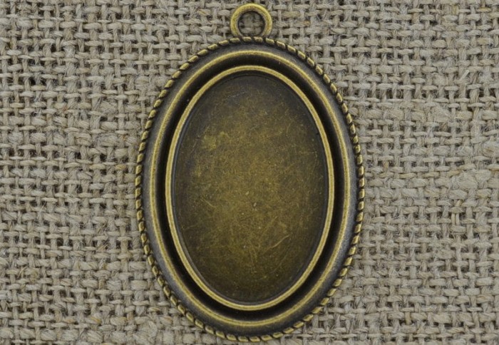 101182 Ozdobna baza medalionu w kolorze brązu na kaboszon 30*20mm