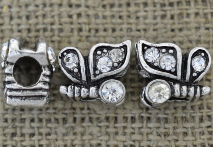 {312176} Koralik modułowy motyl z cyrkoniami w kolorze srebrnym