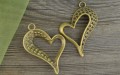 10802 Zawieszka duża serce z miejscami na cyrkonie w kolorze brązu