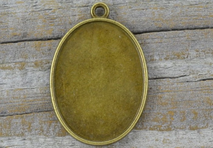 101152 Klasyczna baza medalionu w kolorze brązu na kaboszon 23*17mm