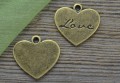 107237 Zawieszka mała w kształcie serduszka z napisem Love w kolorze brązu