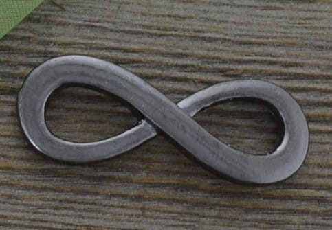 c1201 Element ozdobny łącznik znak nieskończoności w kolorze czarnym