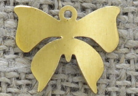 [207127] Zawieszka mała kokardka w kolorze złotym