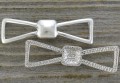 312123 Element ozdobny łącznik kokardka 38*11mm
