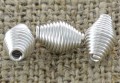 312133 Element ozdobny sprężynka w kolorze srebrnym 10szt