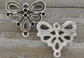312126 Element ozdobny łącznik motyl z miejscami na cyrkonie 22*20mm