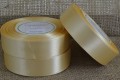 [825039] Wstążka satynowa 25mm 32mb bladozłota