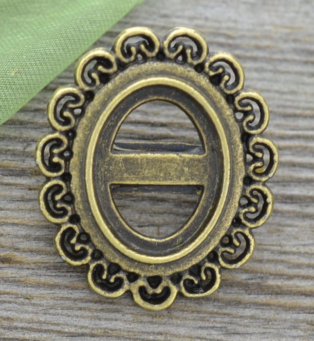 10236 Ozdobna baza broszki w kolorze brązu na kaboszon 16x13mm